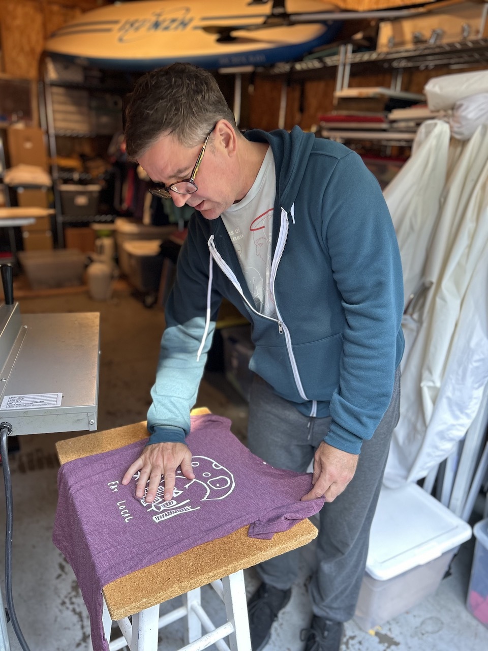 Matt Wayne of Be Good Monster admiring finished t-shirt 